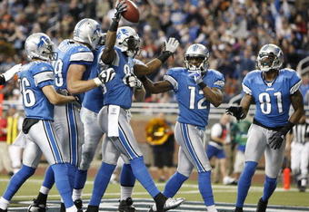 DETROIT - JANUARY 03: Bryant Johnson #80 of the Detroit Lions celebrates a second quarter touchdown with Calvin Johnson #81 and Derrick Williams #12 while playing the Chicago Bears on January 3, 2010 at Ford Field in Detroit, Michigan.  (Photo by Gregory Shamus/Getty Images)