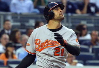 NEW YORK - JULY 20:  Nick Markakis #21 of the Baltimore Orioles bats against the New York Yankees on July 20, 2009 at Yankee Stadium in the Bronx borough of New York City.  (Photo by Jim McIsaac/Getty Images)