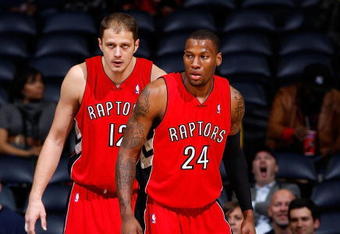 ATLANTA - DECEMBER 02:  Sonny Weems #24 and Rasho Nesterovic #12 of the Toronto Raptors against the Atlanta Hawks at Philips Arena on December 2, 2009 in Atlanta, Georgia.  NOTE TO USER: User expressly acknowledges and agrees that, by downloading and/or using this Photograph, User is consenting to the terms and conditions of the Getty Images License Agreement.  (Photo by Kevin C. Cox/Getty Images)