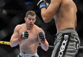 PORTLAND, OR - AUGUST 29:  UFC fighter Nate Marquardt (L) battles UFC fighter Demian Maia (R) during their Middleweight bout at UFC 102:  Couture vs. Nogueira at the Rose Garden Arena on August 29, 2009 in Portland, Oregon.  (Photo by Jon Kopaloff/Getty Images)