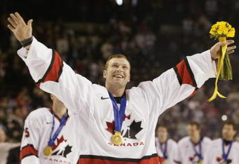 SALT LAKE CITY - FEBRUARY 24:  Goaltender Martin Brodeur #30 of Canada smiles as he skates with his gold medal around his neck after the game against the USA in the men's ice hockey gold medal game at the 2002 Salt Lake City Winter Olympic Games on February 24, 2002 at the E Center in Salt Lake City, Utah.  Canada defeated the USA 5-2.  (Photo by Brian Bahr/Getty Images)