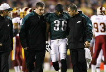 LANDOVER, MD - OCTOBER 26:  Brian Westbrook #36 of the Philadelphia Eagles is escorted off the field after getting hit during the first quarter of the game against the Washington Redskins at FedEx Field October 26, 2009 in Landover, Maryland. (Photo by Win McNamee/Getty Images)