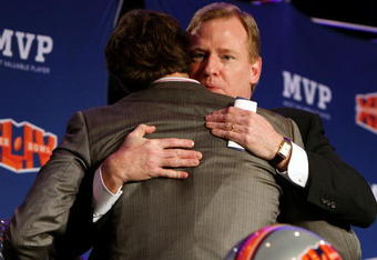 FORT LAUDERDALE, FL - FEBRUARY 08:  Super Bowl XLIV Most Valuable Player, quarterback Drew Brees #9 of the New Orleans Saints hugs NFL Commissioner Roger Goodell before speaking during the Super Bowl Champion Coach Press Conference at the Fort Lauderdale Convention Center on February 8, 2010 in Fort Lauderdale, Florida.  (Photo by Doug Benc/Getty Images)