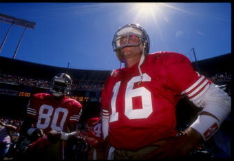 16 Sep 1990:  San Francisco 49ers wide receiver Jerry Rice (left) and quarterback Joe Montana look on during a game against the Washington Redskins at RFK Stadium in Washington, D. C.  The 49ers won the game, 26-13. Mandatory Credit: Mike Powell  /Allspor