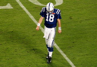 MIAMI GARDENS, FL - FEBRUARY 07:  Peyton Manning #18 of the Indianapolis Colts reacts as he walks off the field against the New Orleans Saints during Super Bowl XLIV on February 7, 2010 at Sun Life Stadium in Miami Gardens, Florida.  (Photo by Doug Benc/Getty Images)