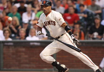SAN FRANCISCO - AUGUST 28:  Randy Winn #2 of the San Francisco Giants lays down a sacrafice bunt in the first inning against the Colorado Rockies during a Major League Baseball game at AT&T Park on August 28, 2009 in San Francisco, California.  (Photo by Jed Jacobsohn/Getty Images)