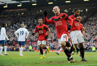 MANCHESTER, ENGLAND - FEBRUARY 06:  Wayne Rooney of Manchester United celebrates scoring to make it 1-0 during the Barclays Premier League match between Manchester United and Portsmouth at Old Trafford on February 6, 2010 in Manchester, England.  (Photo by Michael Regan/Getty Images)