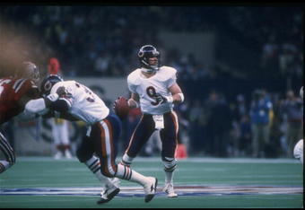 26 Jan 1986: Quarterback Jim McMahon of the Chicago Bears looks to pass the ball against the New England Patriots during Super Bowl XX at the Superdome in New Orleans, Louisiana. The Bears won the game, 46-10.