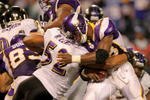 MINNEAPOLIS - OCTOBER 18:  Linebacker Ray Lewis #52 of the Baltimore Ravens makes a tackle on running back Adrian Peterson #28 of the Minnesota Vikings on first and goal from the two in the fourth quarter during NFL action at Hubert H. Humphrey Metrodome on October 18, 2009 in Minneapolis, Minnesota. The Vikings defeated the Ravens 33-31.  (Photo by Doug Pensinger/Getty Images)