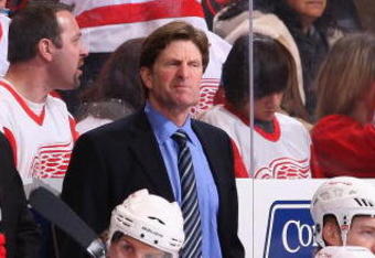 GLENDALE, AZ - JANUARY 02:  Head coach Mike Babcock of the Detroit Red Wings watches from the bench during the NHL game against the Phoenix Coyotes at Jobing.com Arena on January 2, 2010 in Glendale, Arizona.  The Red Wings defeated the Coyotes 4-1. (Photo by Christian Petersen/Getty Images)