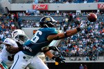 JACKSONVILLE, FL - DECEMBER 13:  Zach Miller #86 of the Jacksonville Jaguars attempts to catch a pass against Yeremiah Bell #37 of the Miami Dolphins during the game at Jacksonville Municipal Stadium on December 13, 2009 in Jacksonville, Florida.  The Dolphins won 14-10.  (Photo by Sam Greenwood/Getty Images)