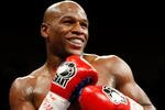 LAS VEGAS - SEPTEMBER 19:  Floyd Mayweather Jr. smiles in the ring during his fight against Juan Manuel Marquez at the MGM Grand Garden Arena September 19, 2009 in Las Vegas, Nevada. Mayweather won by unanimous decision.  (Photo by Ethan Miller/Getty Images)