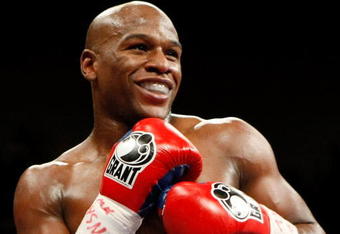 LAS VEGAS - SEPTEMBER 19:  Floyd Mayweather Jr. smiles in the ring during his fight against Juan Manuel Marquez at the MGM Grand Garden Arena September 19, 2009 in Las Vegas, Nevada. Mayweather won by unanimous decision.  (Photo by Ethan Miller/Getty Images)