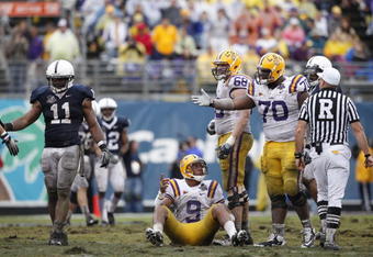 ORLANDO, FL - JANUARY 1: Jordan Jefferson #9 of the LSU Tigers lobbies for a late hit after being hit by Navorro Bowman #11 of the Penn State Nittany Lions during the 2010 Capital One Bowl at the Florida Citrus Bowl Stadium on January 1, 2010 in Orlando, Florida. Penn State won 19-17. (Photo by Joe Robbins/Getty Images)