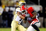 ATLANTA - NOVEMBER 28:  Morgan Burnett #1 of the Georgia Tech Yellow Jackets against Caleb King #4 of the Georgia Bulldogs at Bobby Dodd Stadium on November 28, 2009 in Atlanta, Georgia.  (Photo by Kevin C. Cox/Getty Images)