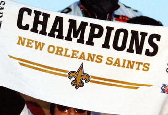 NEW ORLEANS - FEBRUARY 09:  Nick Leckey #60 and Quarterback Drew Brees #9 of the New Orleans Saints celebrate as they parade though the city after winning Super Bowl XLIV on February 9, 2010 in New Orleans, Louisiana.  (Photo by Sean Gardner/Getty Images)