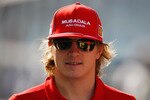 ABU DHABI, UNITED ARAB EMIRATES - NOVEMBER 01:  Kimi Raikkonen of Finland and Ferrari attends the drivers parade before the Abu Dhabi Formula One Grand Prix at the Yas Marina Circuit on November 1, 2009 in Abu Dhabi, United Arab Emirates.  (Photo by Mark Thompson/Getty Images)