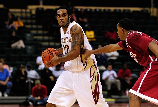 ORLANDO, FL - NOVEMBER 27:  Derwin Kitchen #22 of the Florida State Seminoles looks to pass against MikhailTorrance #2 of the Alabama Crimson Tide during the Old Spice Classic at Disney's Milk House on November 27, 2009 in Orlando, Florida.  (Photo by Sam Greenwood/Getty Images)