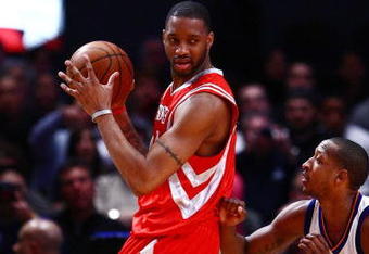 NEW YORK - JANUARY 26:  Tracy McGrady #1 of the Houston Rockets looks to play the ball against Chris Duhon #1 of the New York Knicks on January 26, 2009 at Madison Square Garden in New York City.  NOTE TO USER: User expressly acknowledges and agrees that, by downloading and/or using this Photograph, User is consenting to the terms and conditions of the Getty Images License Agreement.  (Photo by Chris McGrath/Getty Images)