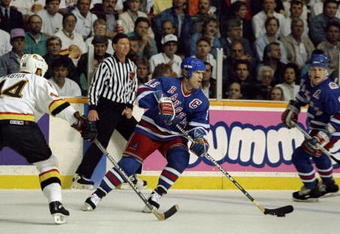 Jun 1994:  Mark Messier #11 of the New York Rangers takes control of the puck during the Stanley Cup Finals against the Vancover Canucks at the Pacific Coliseum in Vancover, Canada. Mandatory Credit: Mike Powell  /Allsport