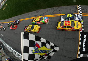 DAYTONA BEACH, FL - FEBRUARY 11:  Jimmie Johnson, driver of the #48 Lowe's Chevrolet, crosses the finish line ahead of Kevin Harvick, driver of the #29 Shell/Pennzoil Chevrolet, to win the first NASCAR Sprint Cup Series Gatorade Duel at Daytona International Speedway on February 11, 2010 in Daytona Beach, Florida.  (Photo by Todd Warshaw/Getty Images)