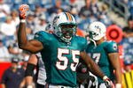FOXBORO, MA - SEPTEMBER 21: Joey Porter #55 of the Miami Dolphins reacts after a sack against the New England Patriots at Gillette Stadium on September 21, 2008 in Foxboro, Massachusetts. (Photo by Jim Rogash/Getty Images)