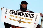 NEW ORLEANS - FEBRUARY 09:  Nick Leckey #60 and Quarterback Drew Brees #9 of the New Orleans Saints celebrate as they parade though the city after winning Super Bowl XLIV on February 9, 2010 in New Orleans, Louisiana.  (Photo by Sean Gardner/Getty Images)