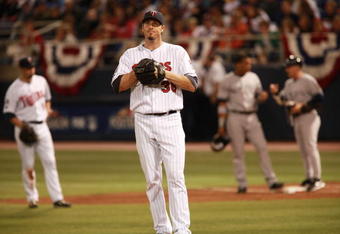 MINNEAPOLIS, MN - OCTOBER 11: Pitcher Joe Nathan #36 of the Minnesota Twins sighs after Alex Rodriguez #13 of the New York Yankees scored in the ninth inning on a Robinson Cano #24 of the Yankees single RBI in Game Three of the ALDS during the 2009 MLB Playoffs at the Hubert H. Humphrey Metrodome on October 11, 2009 in Minneapolis, Minnesota. The Yankees defeated the Twins 4-1. (Photo by Genevieve Ross/Getty Images)