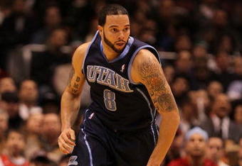 EAST RUTHERFORD, NJ - DECEMBER 16:  Deron Williams #8 of The Utah Jazz dunks against the New Jersey Nets during their game on December 16th, 2009 at The Izod Center in East Rutherford, New Jersey.  NOTE TO USER: User expressly acknowledges and agrees that, by downloading and/or using this Photograph, user is consenting to the terms and conditions of the Getty Images License Agreement. Photo By Al Bello/Getty Images  (Photo by Al Bello/Getty Images)
