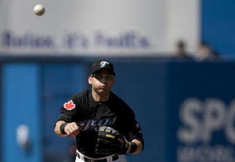 TORONTO, ON - SEPTEMBER 06:  Marco Scutaro #29 of the Toronto Blue Jays completes the double play with Jerry Hairston Jr. #17 of the New York Yankees sliding in during the game on September 6, 2009 at the Rogers Centre in Toronto, Canada.  (Photo by Paul Giamou/Getty Images)