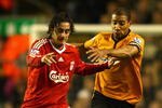 LIVERPOOL, ENGLAND - DECEMBER 26:  Alberto Aquilani of Liverpool battles for the ball with Karl Henry of Wolverhampton Wanderers during the Barclays Premier League match between Liverpool and Wolverhampton Wanderers at Anfield on December 26, 2009 in Liverpool, England.  (Photo by Clive Brunskill/Getty Images)