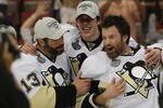 DETROIT - JUNE 12: (L-R) Bill Guerin #13,  Evgeni Malkin #71 and Petr Sykora #17 of the Pittsburgh Penguins celebrate following the Penguins victory over the Detroit Red Wings in Game Seven of the 2009 NHL Stanley Cup Finals at Joe Louis Arena on June 12, 2009 in Detroit, Michigan. (Photo by Bruce Bennett/Getty Images)