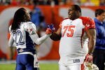 MIAMI GARDENS, FL - JANUARY 31:  Former Patriots teammates Asante Samuel #22 of the NFC's Philadelphia Eagles and Vincent Wilfork #75 of the AFC's New England Patriots greet one another on the field during the 2010 AFC-NFC Pro Bowl game at Sun Life Stadium on January 31, 2010 in Miami Gardens, Florida. The AFC defeated the NFC 41-34. (Photo by Scott Halleran/Getty Images)