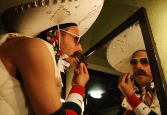 LOS ANGELES, CA - MAY 05:  Performer Jack Ruby prepares to go onstage at the Lucha Vavoom Cinco de Mayan! show at the Mayan Theater on Cinco de Mayo, May 5, 2009 in Los Angeles, California. Lucha Vavoom combines elements of theatrical Mexican masked wrestling shows known as  Lucha Libre with American burlesque. Cinco de Mayo, or May Fifth in Spanish, celebrates the unlikely victory of 5,000 ill-equipped Mestizo and Zapotec Indians led by General Ignacio Zaragoza over the the much better-equipped French forces at the Battle of Puebla on May 5, 1862 in Puebla, Mexico. In the US, Cinco de Mayo is often mistakenly equated with Mexican Independence which was on September 16, 1810.  (Photo by David McNew/Getty Images)