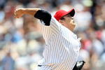 NEW YORK - JULY 04:  Chien-Ming Wang #40 of the New York Yankees pitches against the Toronto Blue Jays on July 4, 2009 at Yankee Stadium in the Bronx borough of New York City.  (Photo by Nick Laham/Getty Images)