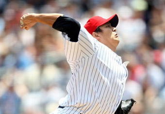 NEW YORK - JULY 04:  Chien-Ming Wang #40 of the New York Yankees pitches against the Toronto Blue Jays on July 4, 2009 at Yankee Stadium in the Bronx borough of New York City.  (Photo by Nick Laham/Getty Images)