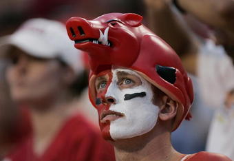 FAYETTEVILLE, AR - SEPTEMBER 2:  A male fan of the Arkansas Razorbacks looks on wearing face paint and a hog hat during the game against the University of Southern California Trojans on September 2, 2006 at Donald W. Reynolds Razorback Stadium in Fayetteville, Arkansas.  Southern California won 50-14.  (Photo by Brian Bahr/Getty Images)