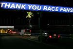 DAYTONA , FL - FEBRUARY 18:  Time shot 8.59 pm Race fans leave the infield after the NASCAR Nextel Cup Series Daytona 500 at Daytona International Speedway on February 18, 2007 in Daytona, Florida. Just minutes after the completion of the NASCAR season's opening race, members of the 63 competing teams already began to dismantle their team's garage and equipment in preparation for travelling to the next race venue. The NASCAR Nextel Cup series season consists of 36 races running over 41 weeks in all parts of the United States; teams usually have five days or less to travel, setup the garages and prepare the cars for the next race. The grueling schedule only begins at the finish line; crew members start their own race to break down the team's garages and load the trucks with the equipment and the team's cars - most hit the road to the next race location within 4 hours after victory circle celebrations. (Photo by Chris McGrath/Getty Images)