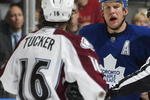 TORONTO, ON - OCTOBER 13:  Darcy Tucker #16 of the Colorado Avalanche has a few words with Mike Komisarek #8 of the Toronto Maple Leafs in a game on October 13, 2009 at the Air Canada Centre in Toronto, Ontario. The Avalanche defeated the Leafs 4-1. (Photo by Claus Andersen/Getty Images)