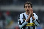TURIN, ITALY - FEBRUARY 14:  Claudio Marchisio of Juventus FC celebrates victory after the Serie A match between Juventus FC and Genoa CFC at Stadio Olimpico on February 14, 2010 in Turin, Italy.  (Photo by Valerio Pennicino/Getty Images)