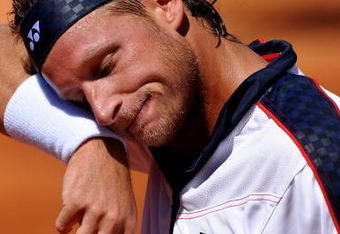 BARCELONA, SPAIN - APRIL 23:  David Nalbandian of Argentina wipes his face during his match against Nicolas Almagro of Spain on day four of the ATP 500 World Tour Barcelona Open Banco Sabadell 2009 tennis tournament at the Real Club de Tenis on April 23, 2009 in Barcelona, Spain. Nalbandian won the match in two sets, 6-3 and 6-4, but has pulled out of tomorows semi-final match against Rafael Nadal due to an injury.  (Photo by Jasper Juinen/Getty Images)