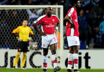 PORTO, PORTUGAL - FEBRUARY 17:  Sol Campbell (C) of Arsenal looks dejected after his pass back to goalkeeper Lukasz Fabianski is given an indirect freekick which Falcao of Porto score their second goal from during the UEFA Champions League last 16 first leg match between FC Porto and Arsenal at the Estadio Do Dragao on February 17, 2010 in Porto, Portugal.  (Photo by Mike Hewitt/Getty Images)