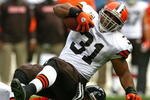 CHICAGO - NOVEMBER 01: Danieal Manning #38 of the Chicago Bears takes down Jamal Lewis #31 of the Cleveland Browns at Soldier Field on November 1, 2009 in Chicago, Illinois. The Bears defeated the Browns 30-6. (Photo by Jonathan Daniel/Getty Images)