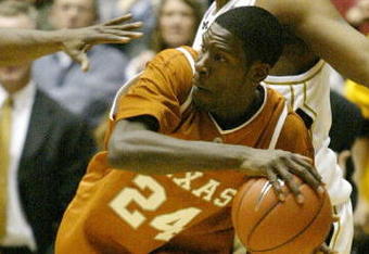 COLUMBIA, MO - JANUARY 20:  Royal Ivey #24 of the Texas Long Horns looks to pass as Arthur Johnson #50 of the Missouri Tigers defends on January 20, 2004 at the Hearnes Center in Columbia, Missouri. Texas defeated Missouri 75-69 in overtime.  (Photo by Elsa/Getty Images)