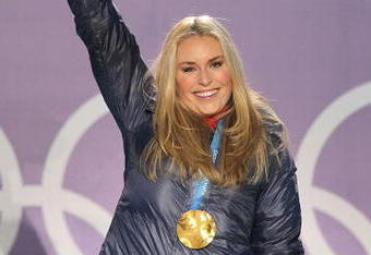 WHISTLER, BC - FEBRUARY 17:  Lindsey Vonn of the United States celebrates with her gold medal during the medal ceremony for the Alpine Skiing Ladies Downhill on day 6 of the Vancouver 2010 Winter Olympics at Whistler Medals Plaza on February 17, 2010 in Whistler, Canada.  (Photo by Doug Pensinger/Getty Images)