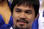 ARLINGTON, TX - JANUARY 19:  Manny Pacquiao poses for photos at Cowboys Stadium on January 19, 2010 in Arlington, Texas.  (Photo by Ronald Martinez/Getty Images)