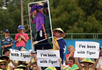 MELBOURNE, AUSTRALIA - JANUARY 21:  Spectators hold up a poster of Tiger Woods during the first round doubles match between Marinko Matosevic and Bernard Tomic of Australia and Martin Damm of the Czech Republic and Filip Polasek of Slovakia during day four of the 2010 Australian Open at Melbourne Park on January 21, 2010 in Melbourne, Australia.  (Photo by Lucas Dawson/Getty Images)