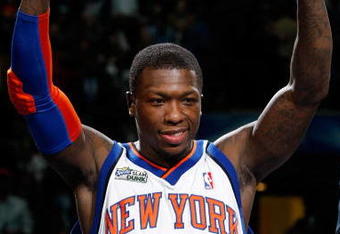 DALLAS - FEBRUARY 13:  Nate Robinson #2 of the New York Knicks reacts during the trophy presentation after his third win during the Sprite Slam Dunk Contest on All-Star Saturday Night, part of 2010 NBA All-Star Weekend at American Airlines Center on February 13, 2010 in Dallas, Texas. NOTE TO USER: User expressly acknowledges and agrees that, by downloading and or using this photograph, User is consenting to the terms and conditions of the Getty Images License Agreement.  (Photo by Ronald Martinez/Getty Images)