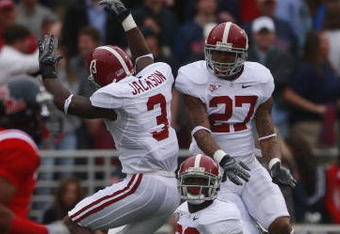 OXFORD, MS - OCTOBER 10:  Kareem Jackson #3, Justin Woodall #27 and Javier Arenas #28 of the Alabama Crimson Tide react after a turnover in their game against the Mississippi Rebels at Vaught-Hemingway Stadium on October 10, 2009 in Oxford, Mississippi. (Photo by Dave Martin/Getty Images)