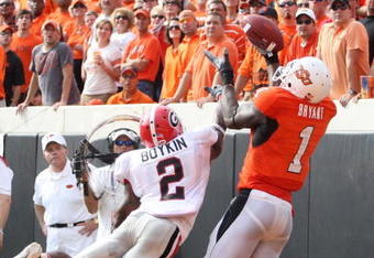 STILLWATER, OK - SEPTEMBER 5:  Runningback Brandon Boykin #2 of the Georgia Bulldogs dives for the ball for the ball as Dez Bryant #1 of the Oklahoma State Cowboys cannot make the pass during the third quarter of the game at Boone Pickens Stadium on September 5, 2009 in Stillwater, Oklahoma. (Photo by Christian Petersen/Getty Images)